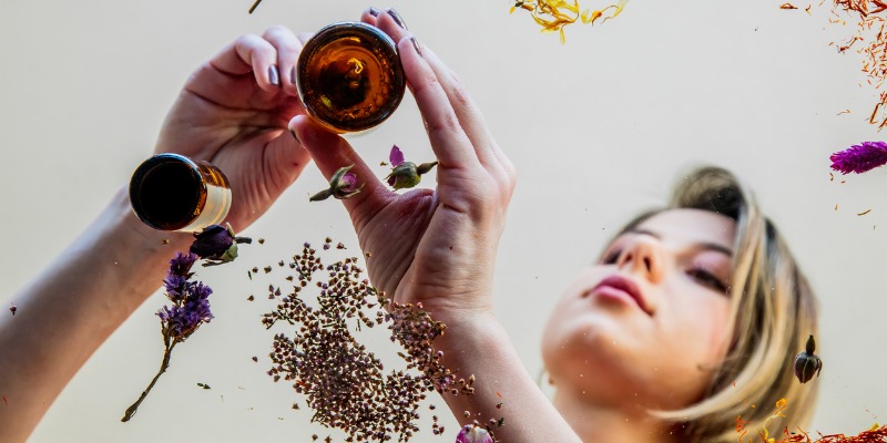 Lab Alley, April 1 2022 - Young woman perfumer preparing herbs and flowers for make a perfume